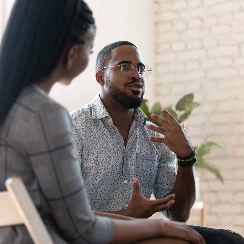 man and woman in conversation