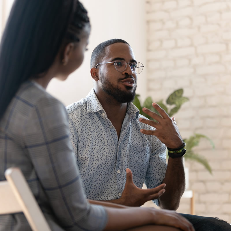 man and woman in conversation